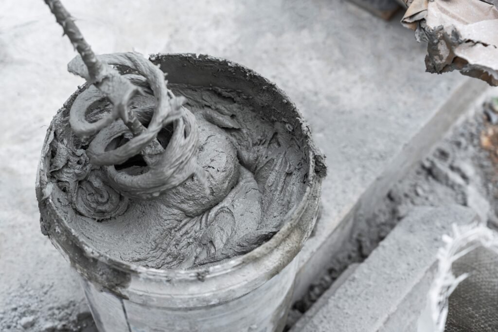 Cement mix in bucket for masonry plaster
