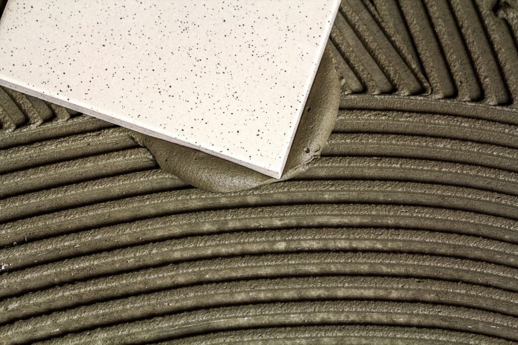 Ceramic tiles and tools for tiler. Floor tiles installation. Home improvement, renovation - ceramic